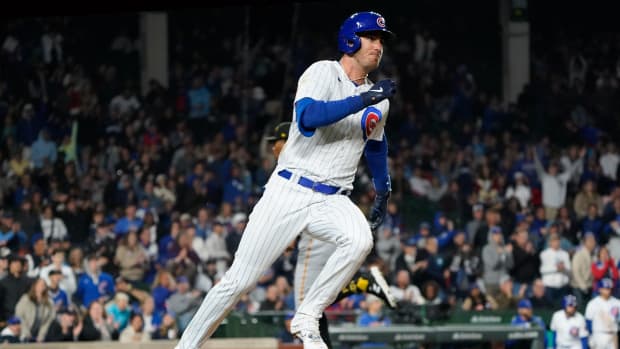 Chicago Cubs first baseman Cody Bellinger runs after hitting an RBI double against the Pittsburgh Pirates. (2023)